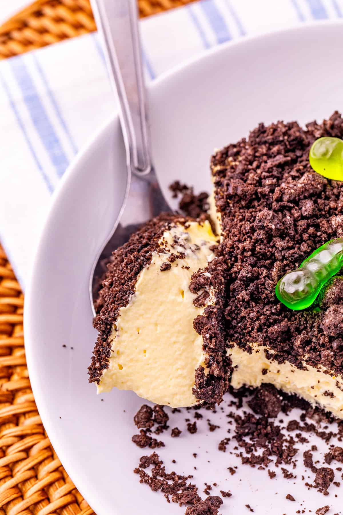 A fork in a plate of Oreo dirt cake