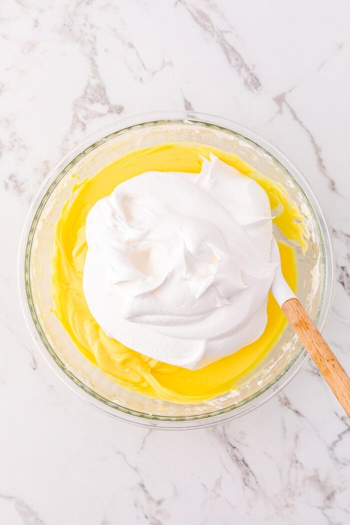 Folding Cool Whip into instant vanilla pudding