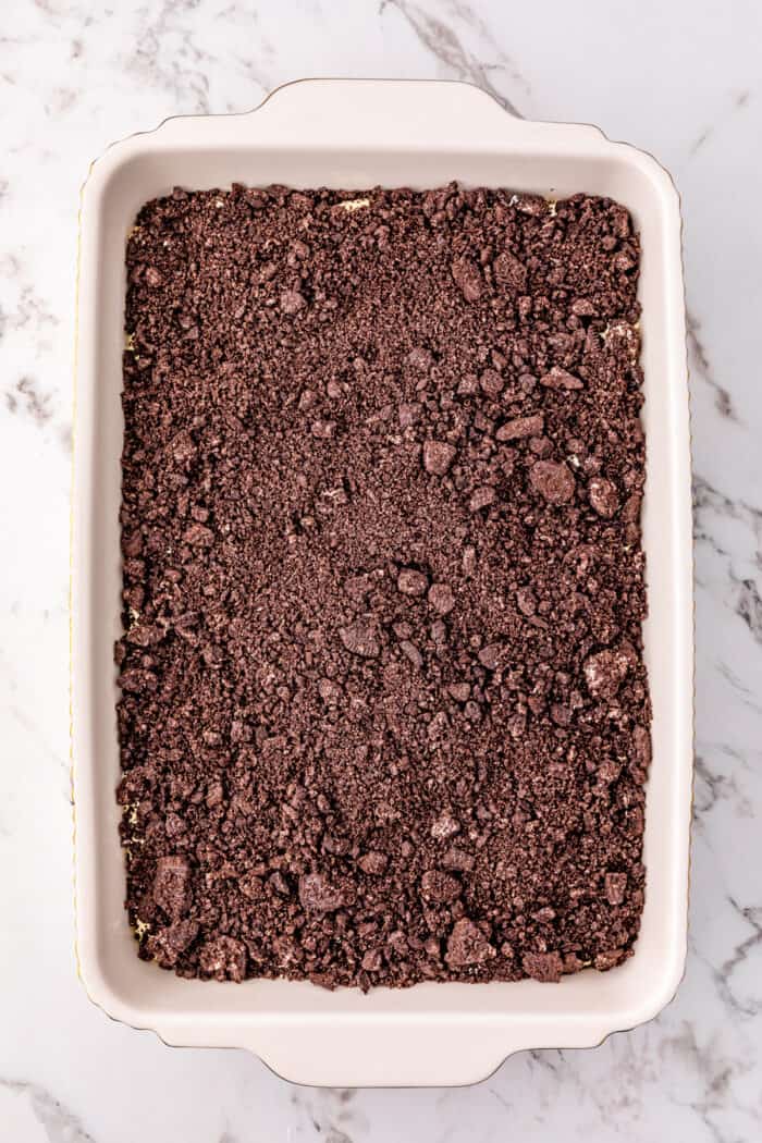 Oreo crumbs in a baking dish