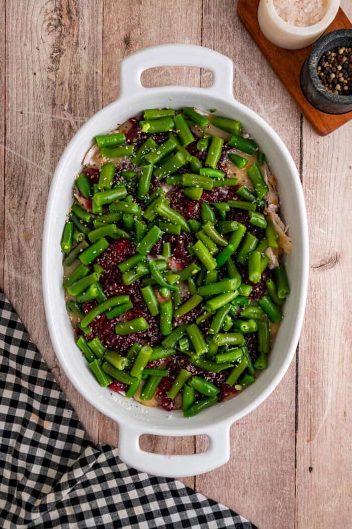 Turkey Stuffing Casserole is an easy way to repurpose Thanksgiving leftovers like turkey, gravy, cranberry sauce, and stuffing. Green beans and cranberry sauce in a baking dish
