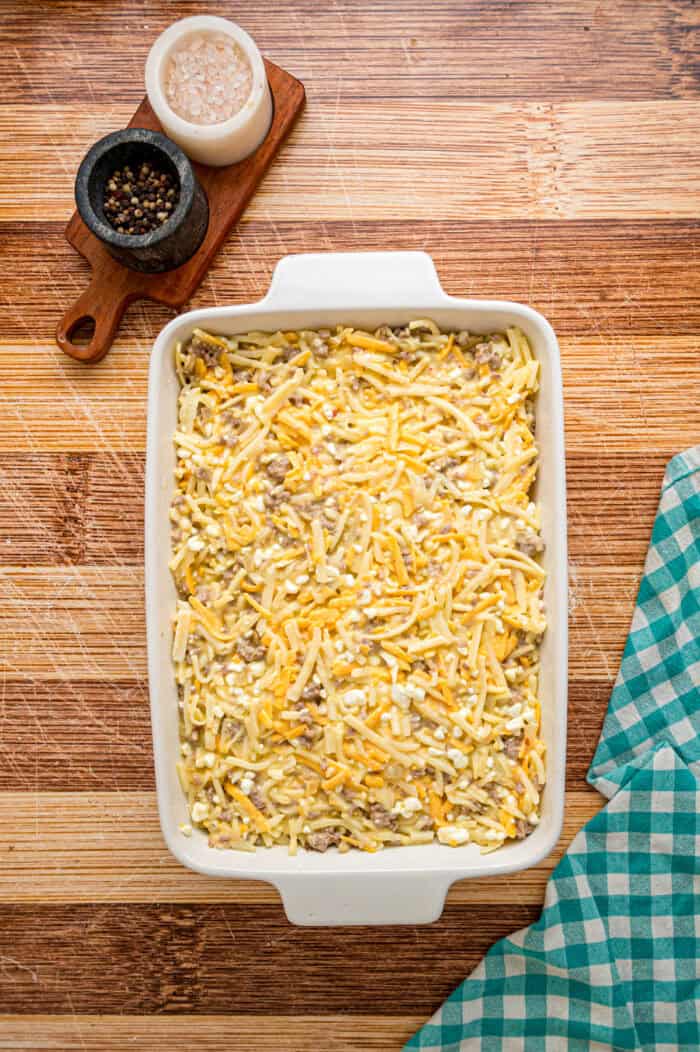 Unbaked breakfast casserole mixture in a baking dish