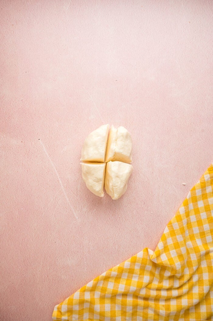 These melt-in-your-mouth Butter Mints are made with just a few ingredients and require no cooking. Easy to customize! Butter dough divided into four