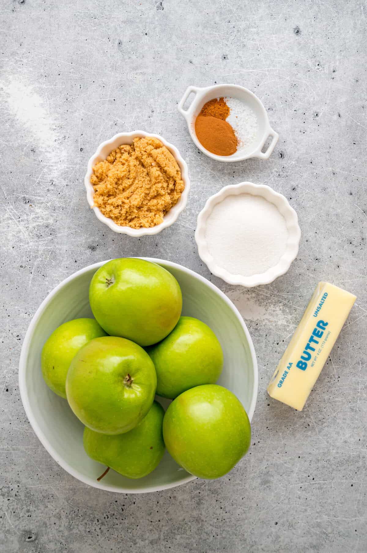 These Southern Fried Apples are warmly spiced, tender, and coated in a yummy brown sugar syrup. Enjoy with ice cream! Overhead view of ingredients needed to make Southern fried apples