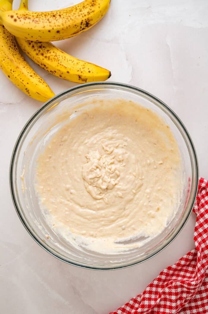 Every bite of these Banana Chocolate Chip Pancakes is dotted with chocolate chips and filled with sweet banana flavor. Pancake batter in a bowl