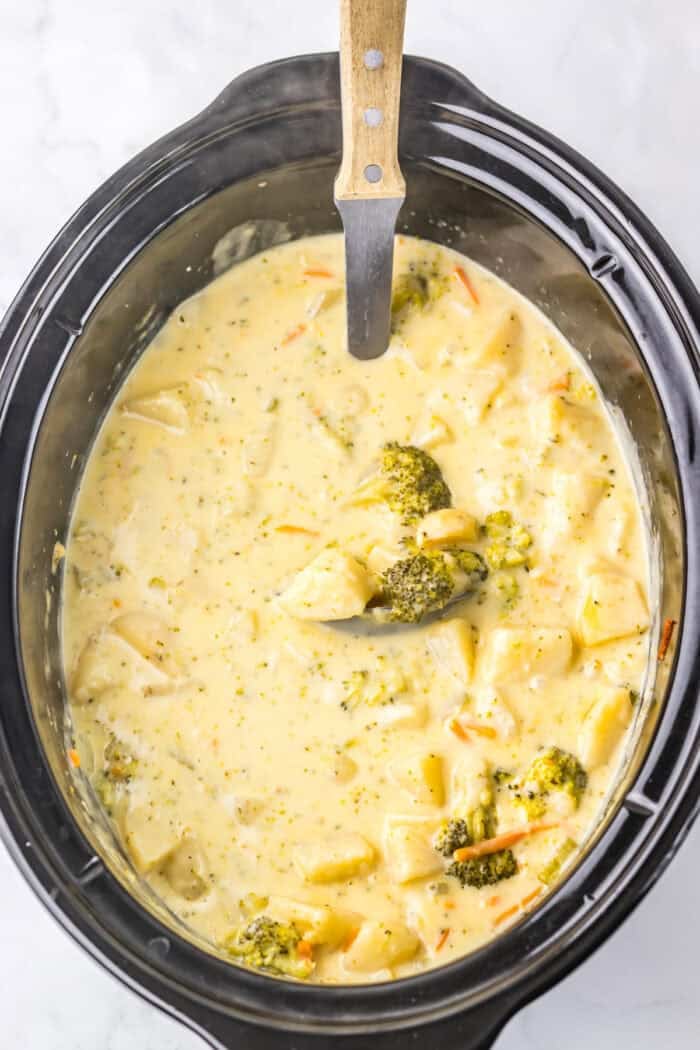 Overhead view of broccoli potato soup in the slow cooker