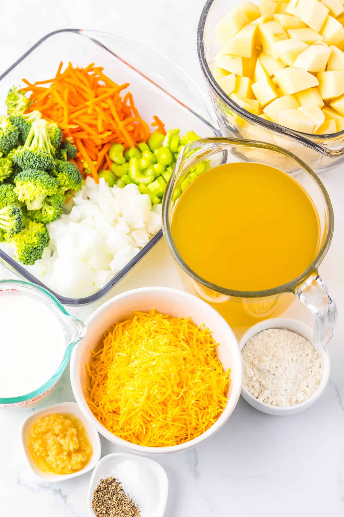 Overhead view of ingredients needed to make broccoli potato soup