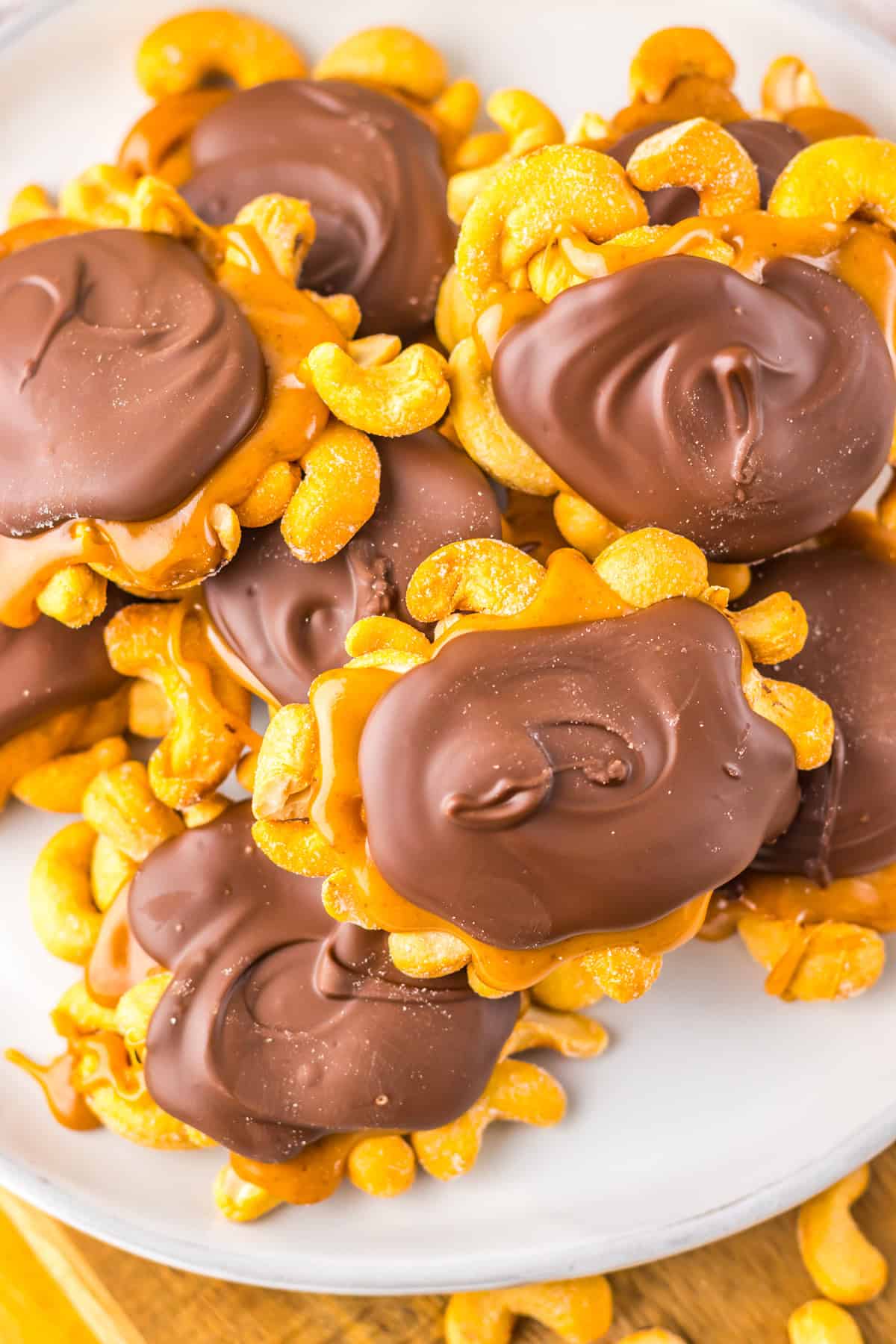 Overhead view of a plate of cashew clusters