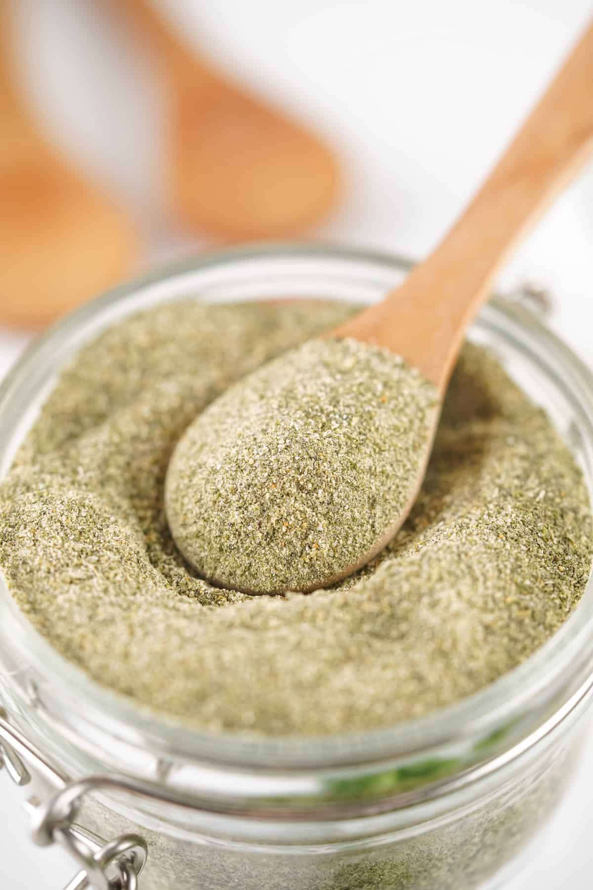 With just 6 simple spices, this Homemade Ranch Seasoning takes less than 5 minutes to prepare. A pantry staple! A wooden spoon in a jar of homemade ranch seasoning