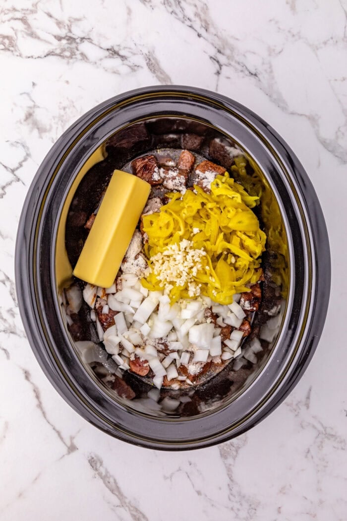 These Mississippi Steak Bites are savory, tangy, and so tender, with chunks of sirloin with ranch seasoning, au jus gravy, and pepperoncini. Seared steak, pepperoncini, and seasonings in a crockpot