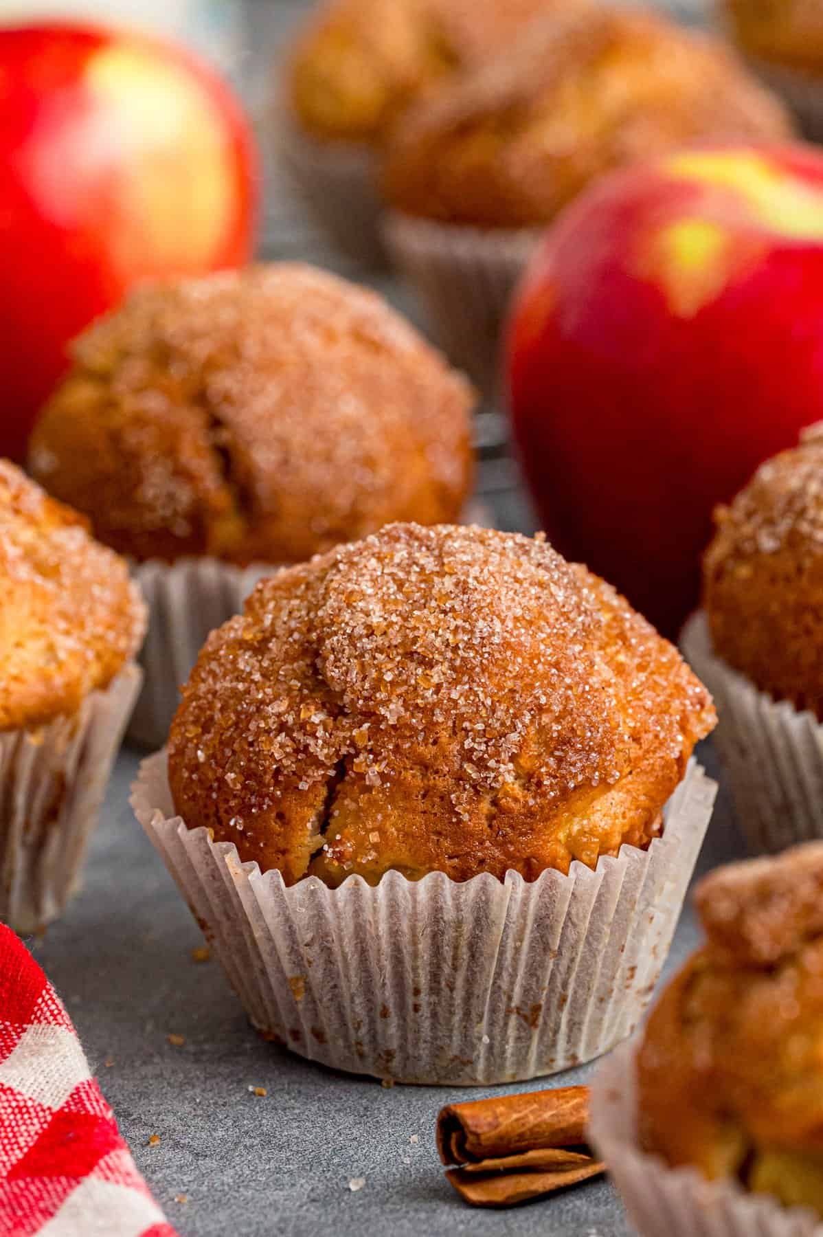 Each bite of these Applesauce Muffins is incredibly moist and infused with warm apple flavor. They look like something straight from a bakery! Applesauce muffins on the counter