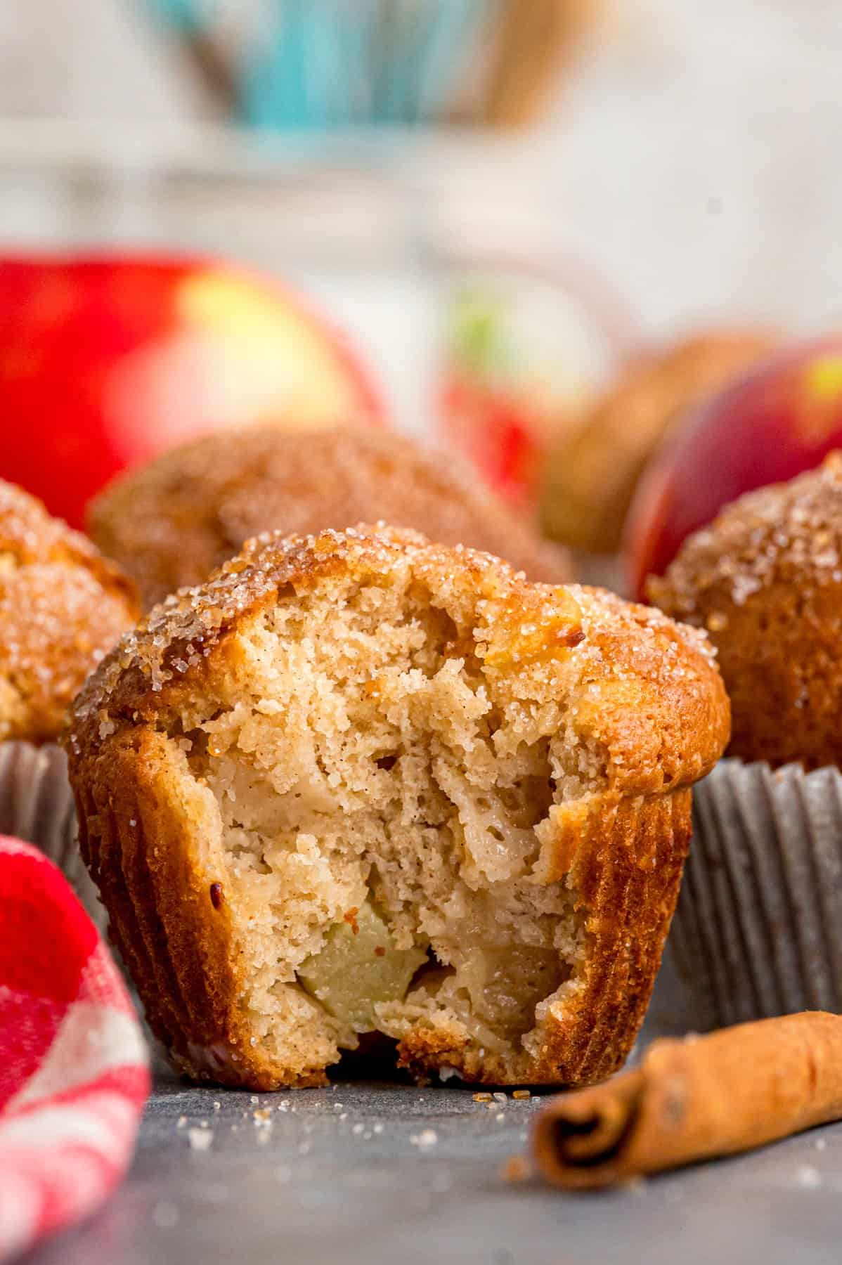 Each bite of these Applesauce Muffins is incredibly moist and infused with warm apple flavor. They look like something straight from a bakery! An applesauce muffin with a bite missing