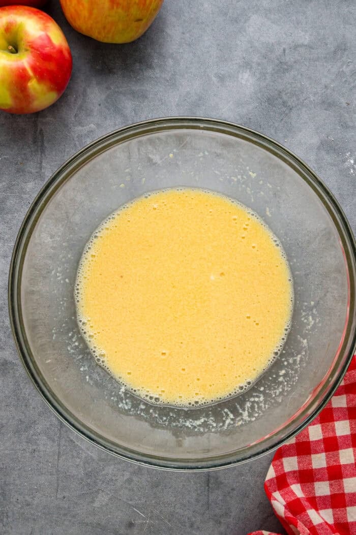 Each bite of these Applesauce Muffins is incredibly moist and infused with warm apple flavor. They look like something straight from a bakery! Wet batter ingredients in a bowl