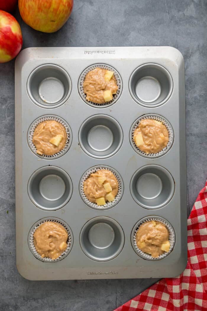 Each bite of these Applesauce Muffins is incredibly moist and infused with warm apple flavor. They look like something straight from a bakery! Muffin batter in a pan
