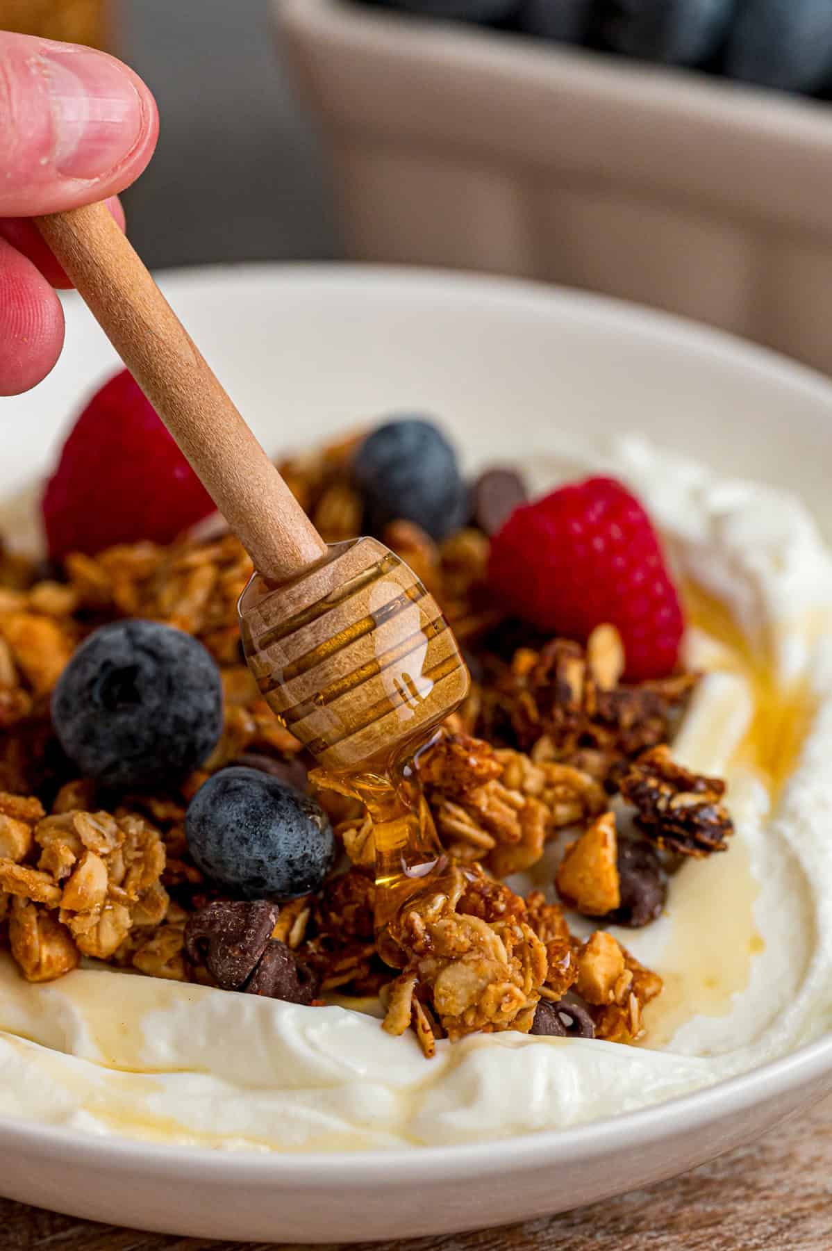 Sweet, nutty, and crunchy, this Peanut Butter Granola is better than anything that can be bought at the store! Drizzling honey over a yogurt bowl with peanut butter granola