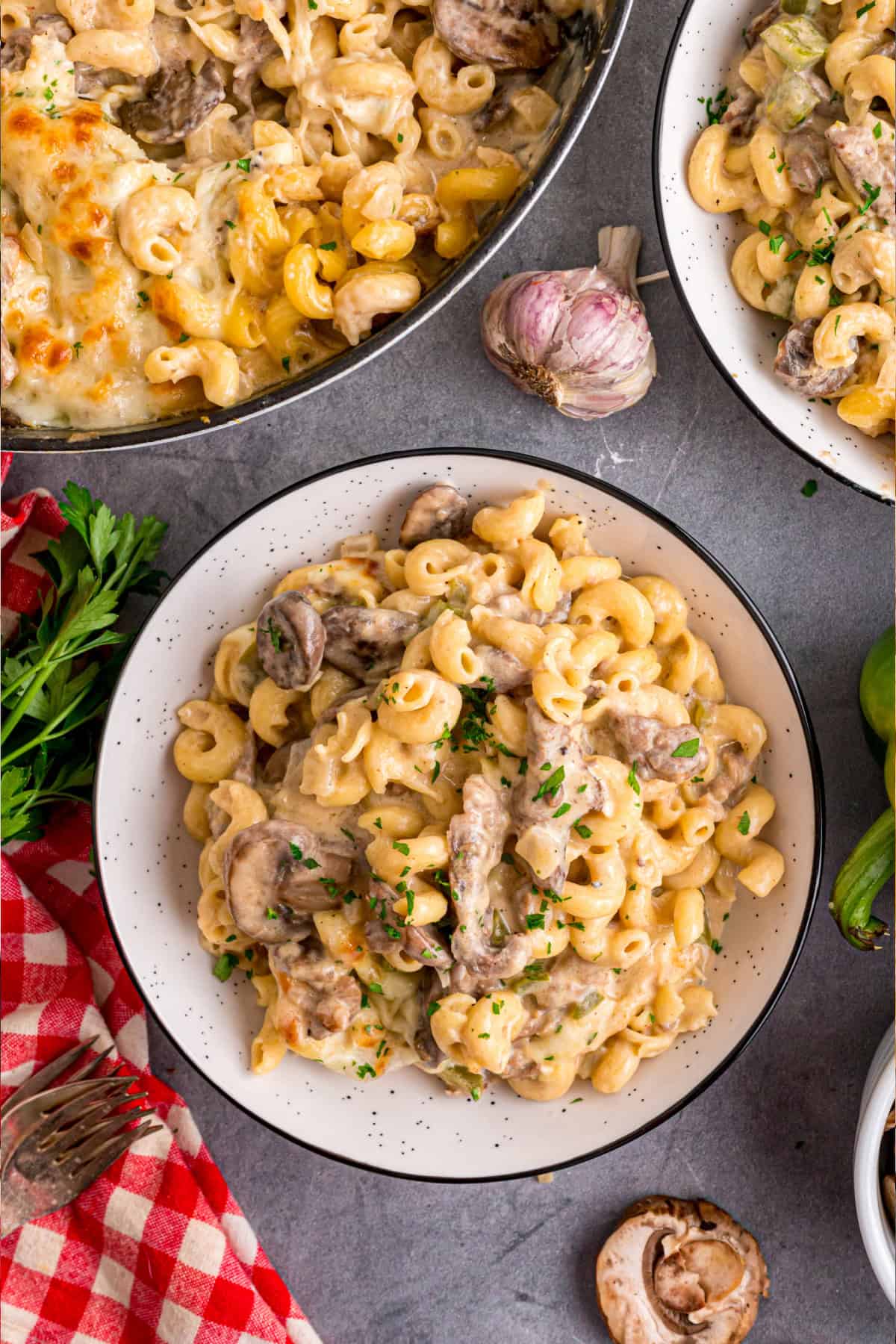 Loaded with sliced ribeye, peppers, onions, mushrooms, and lots of cheese, this Philly Cheesesteak Pasta is an easy one-pan dinner. Philly Cheesesteak Pasta plate