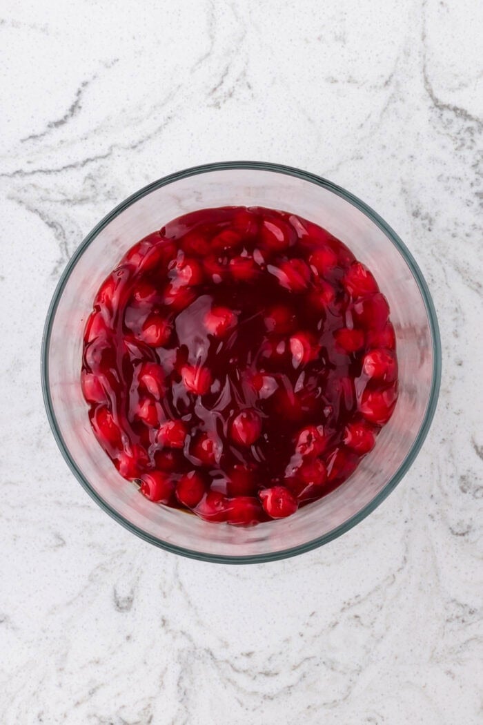 Rich devil’s food cake, cherry pie filling, and homemade whipped cream are layered to make this impressive yet easy Black Forest Trifle. Cherry pie filling in a trifle dish