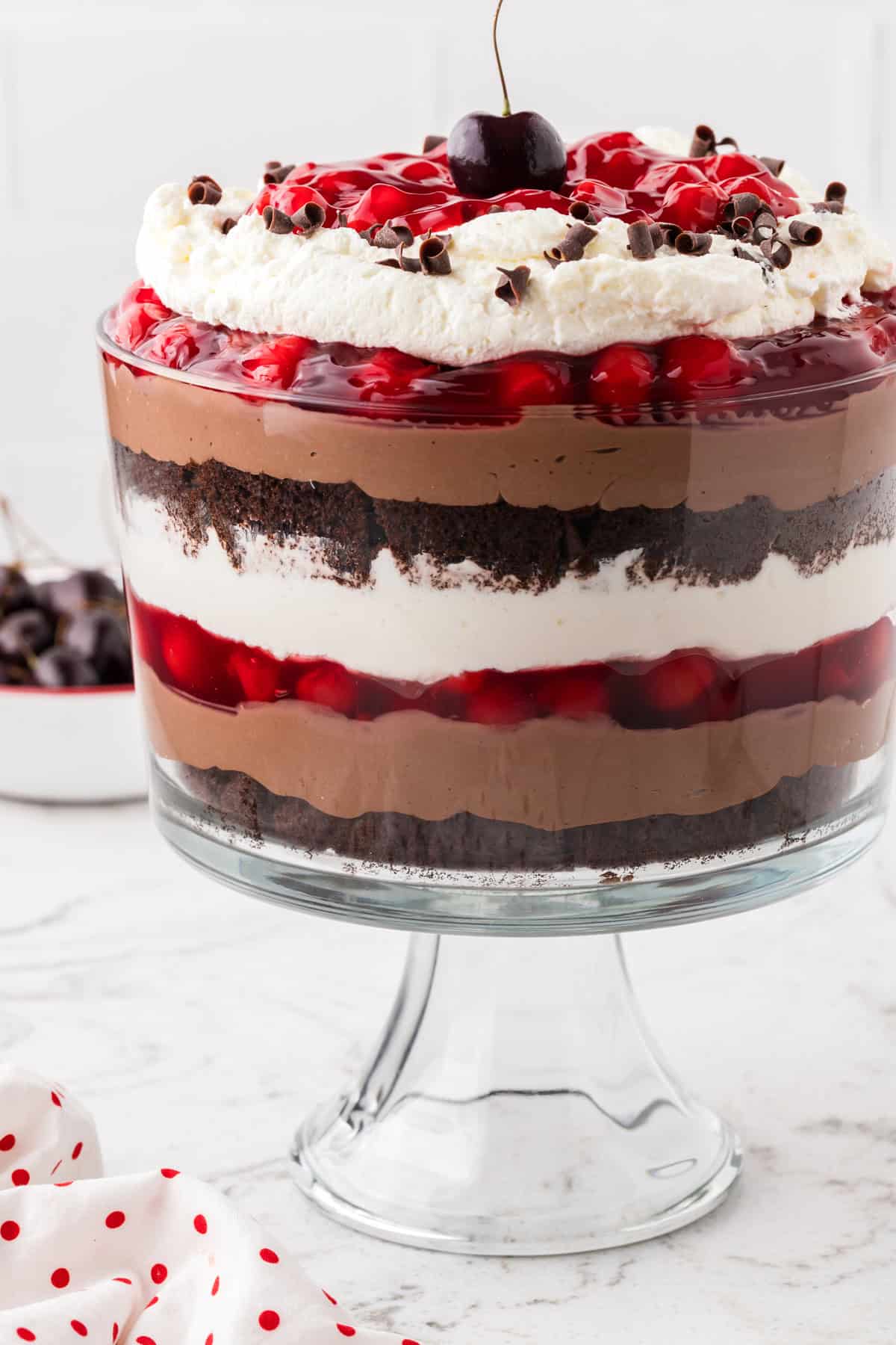 Rich devil’s food cake, cherry pie filling, and homemade whipped cream are layered to make this impressive yet easy Black Forest Trifle. Black forest trifle in a trifle dish