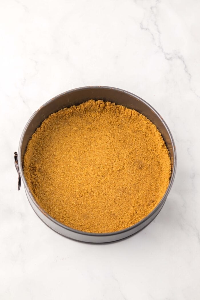 With no baking required, this Little Debbie Christmas Tree Cheesecake is a fun, festive, and nostalgic Christmas treat. Graham cracker crust in a spingform pan