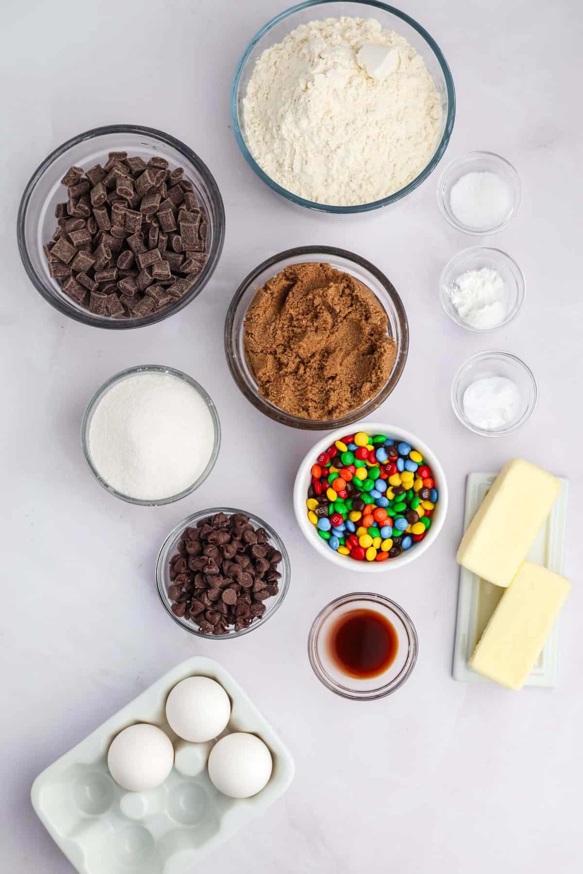 Craving cookies but short on time? These M&M Cookie Bars are like baking a batch of thick, chewy cookies in one pan with 10 minutes of prep. Overhead view of ingredients needed to make M&M cookie bars