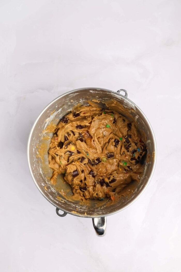 Craving cookies but short on time? These M&M Cookie Bars are like baking a batch of thick, chewy cookies in one pan with 10 minutes of prep. M&M cookie dough in a mixing bowl