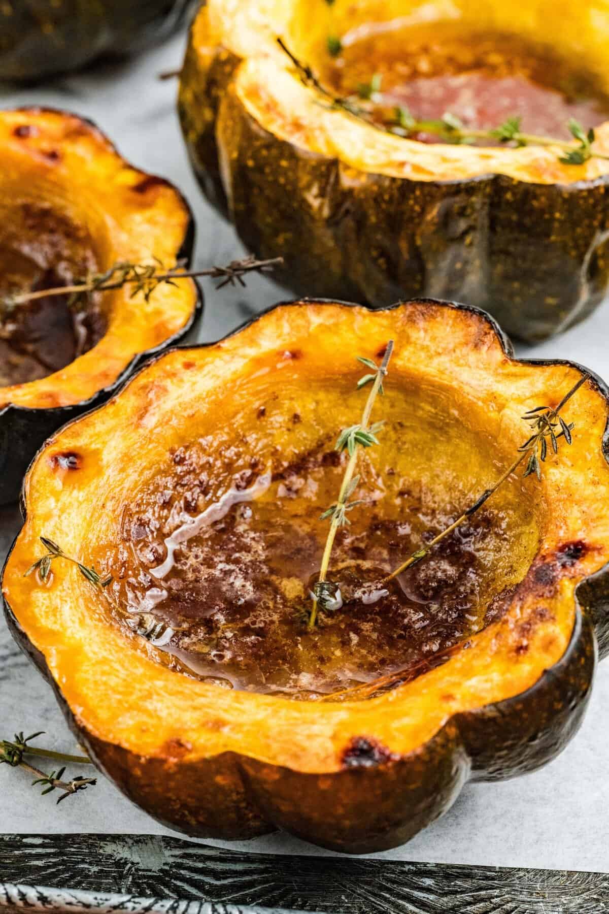 Three halves of roasted acorn squash