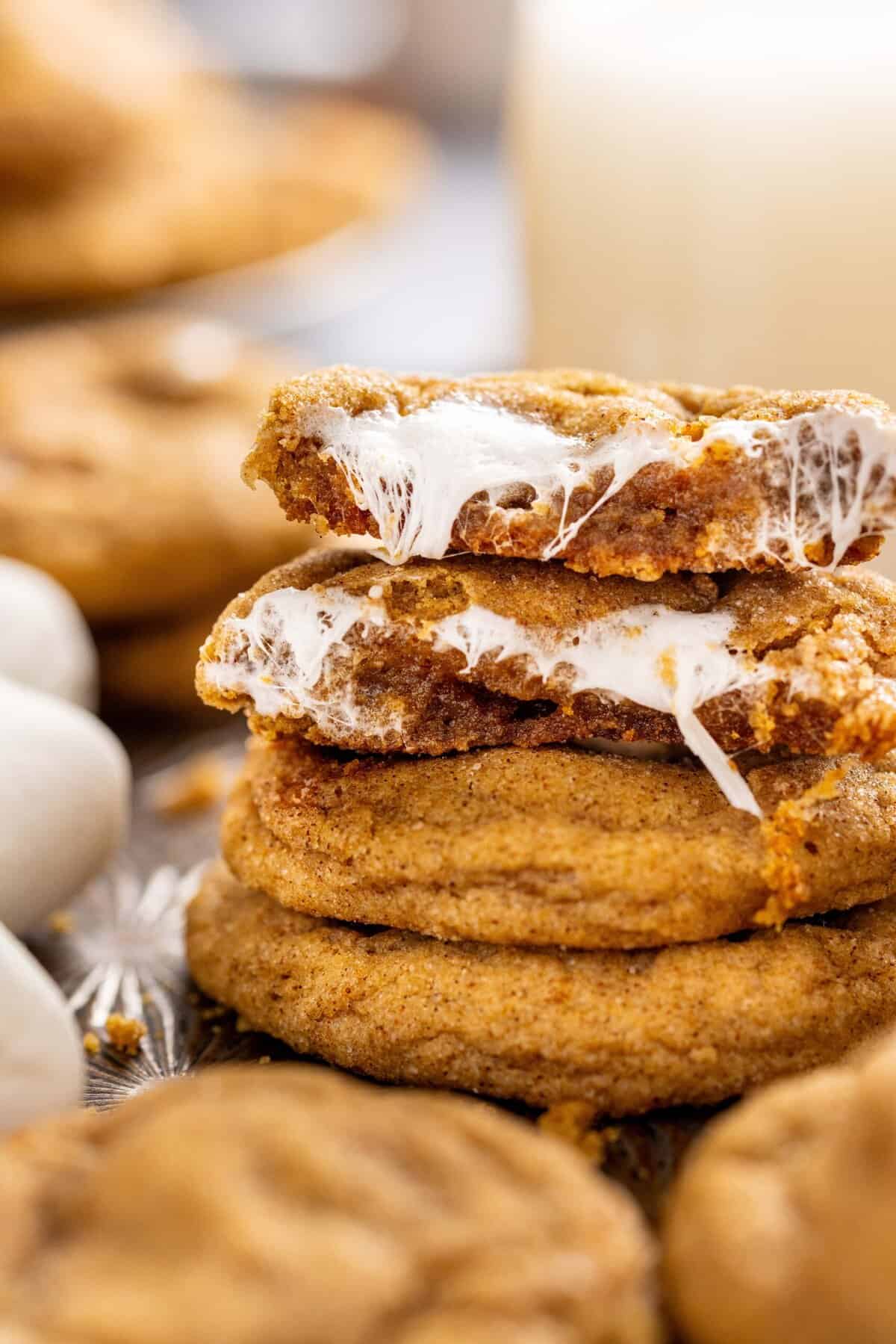 A stack of sweet potato cookies, the top one broke in half to show the marshmallow filling
