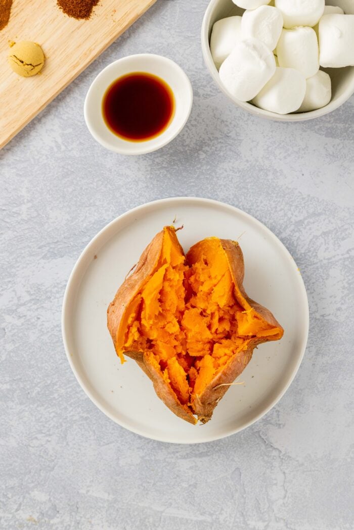 Mashed sweet potato on a white plate