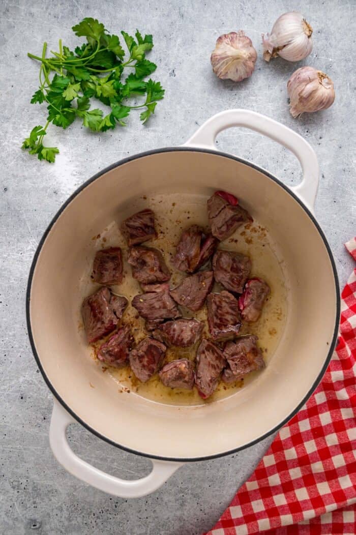 Tender chunks of beef are cooked in a rich, savory gravy and served over egg noodles in this easy Beef and Noodles recipe. Chunks of seared chuck roast