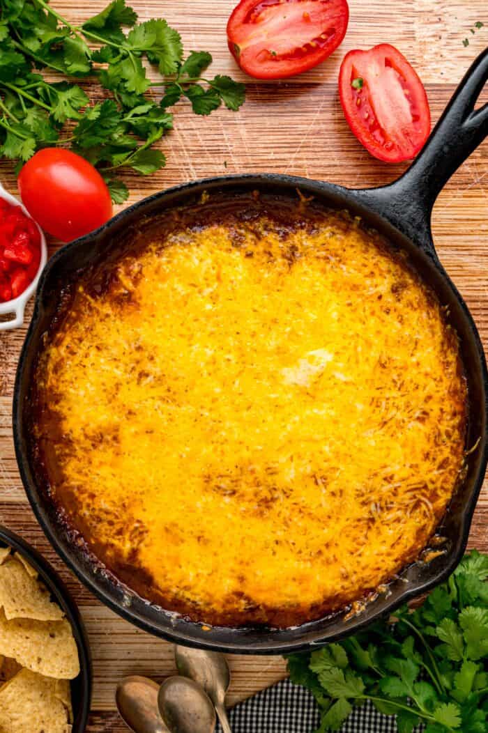 Overhead view of a skillet of chili cheese dip