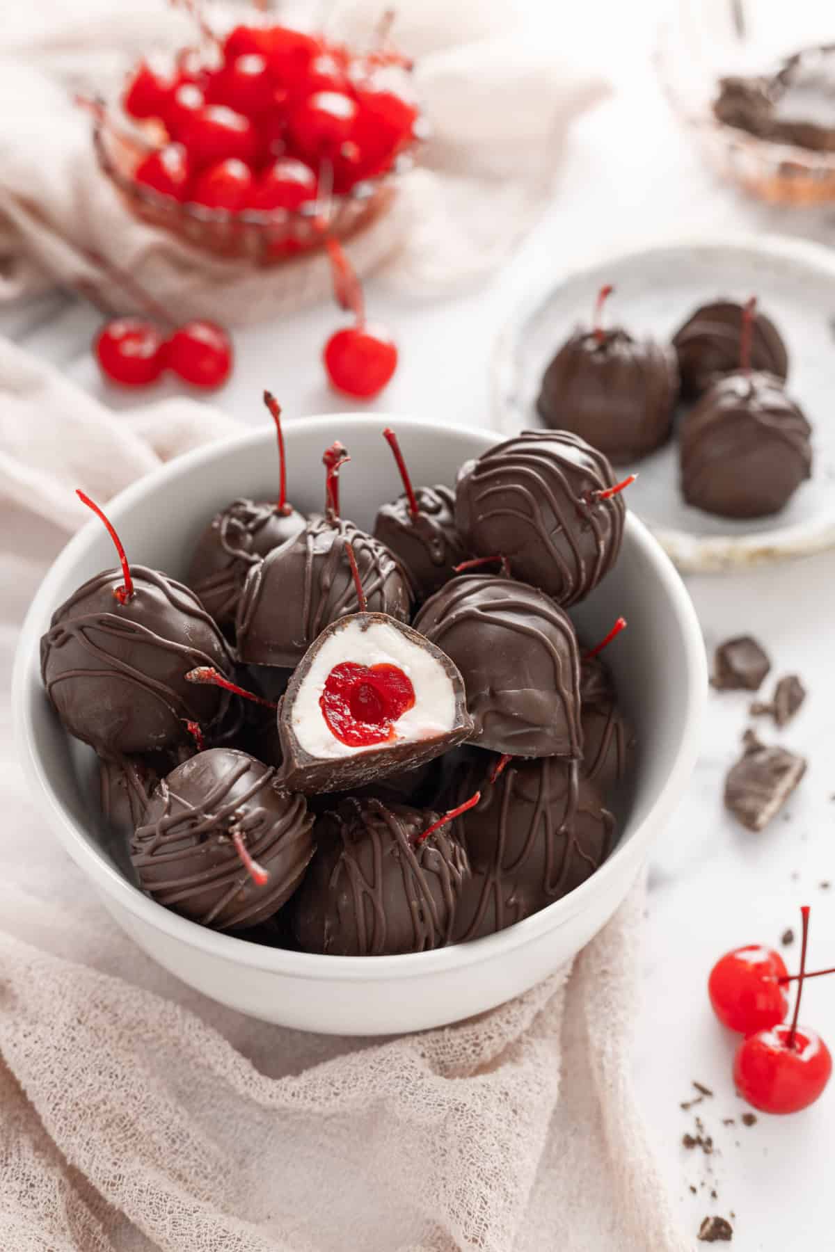 These classic Chocolate Covered Cherries are incredibly easy to make, and always a favorite for Christmas, Valentine's Day, or any time of year. Chocolate Covered Cherries in a bowl