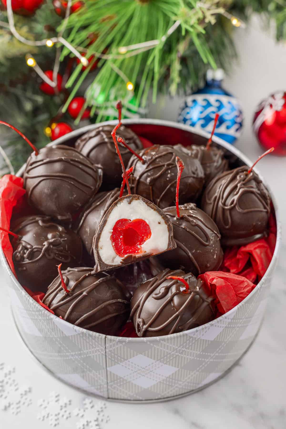 These classic Chocolate Covered Cherries are incredibly easy to make, and always a favorite for Christmas, Valentine's Day, or any time of year. Chocolate Covered Cherries in a Holiday can