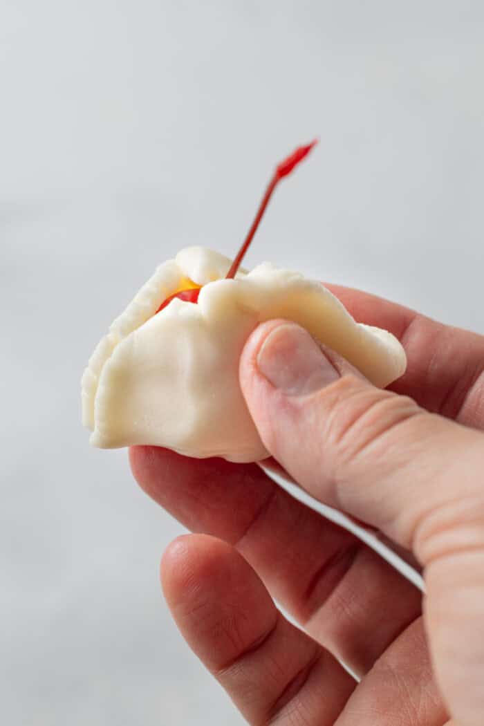 These classic Chocolate Covered Cherries are incredibly easy to make, and always a favorite for Christmas, Valentine's Day, or any time of year. pressing the white candy mixture over the cherries