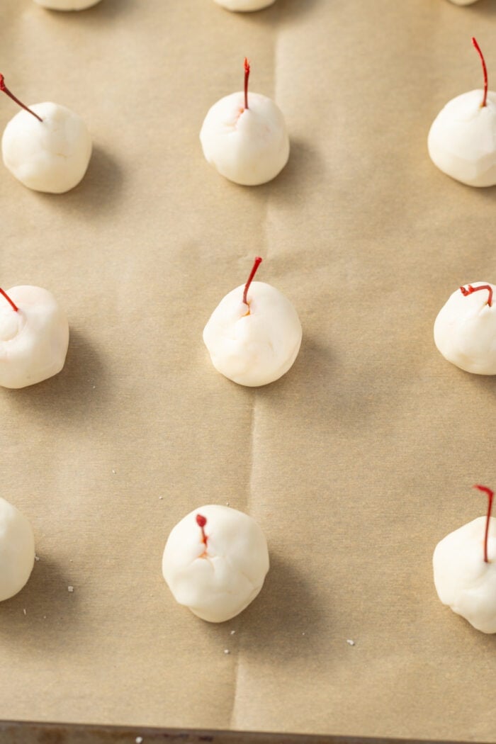 These classic Chocolate Covered Cherries are incredibly easy to make, and always a favorite for Christmas, Valentine's Day, or any time of year. white candy mixture over the cherries