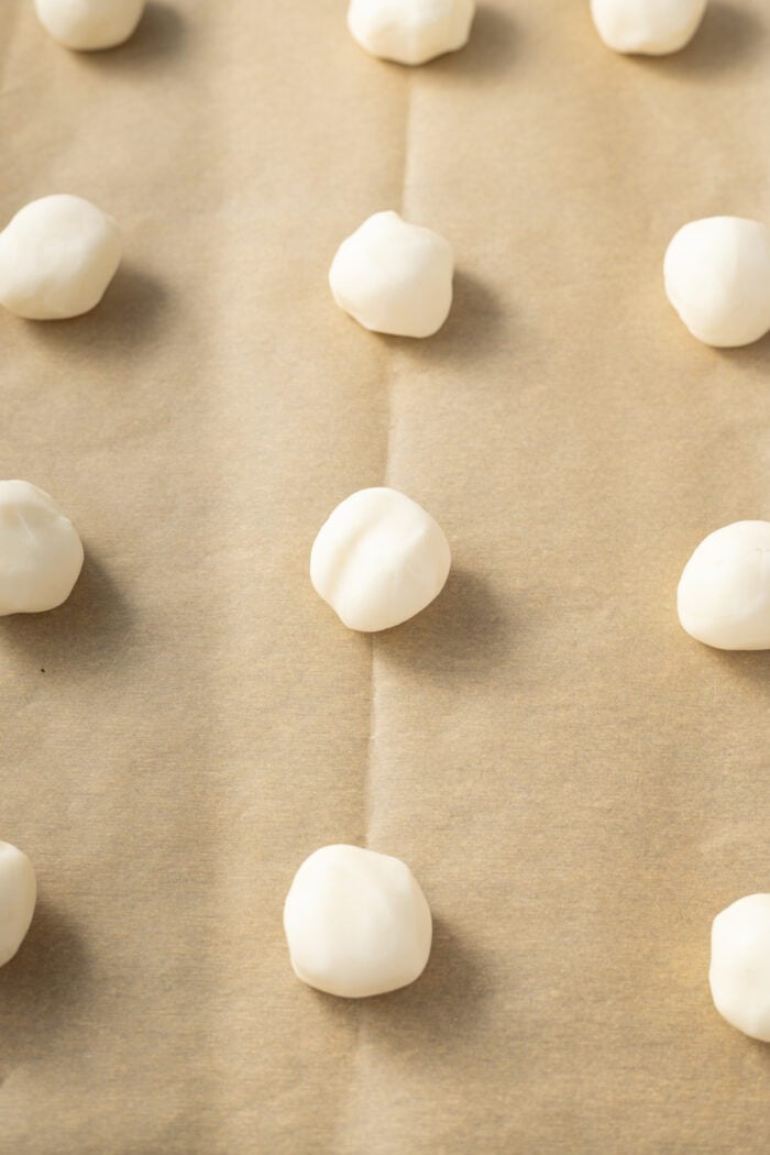 These classic Chocolate Covered Cherries are incredibly easy to make, and always a favorite for Christmas, Valentine's Day, or any time of year. white candy mixture balls