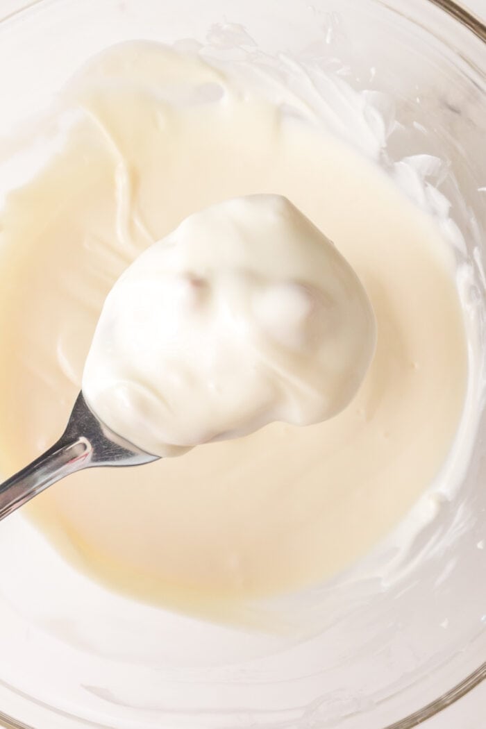 This Polar Bear Paws Candy recipe is a copycat version of See’s Candies that you can easily at home! Dipping the peanut candy mixture into the white chocolate