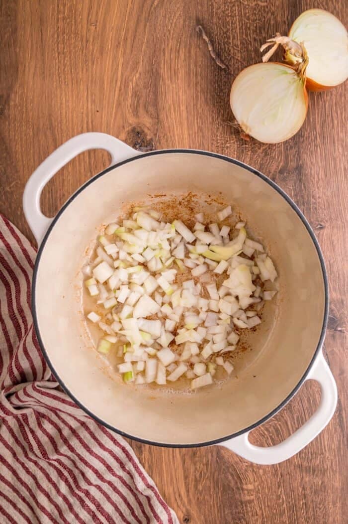 Fresh green beans are slow-cooked until tender with garlic, onion, bacon, and some Cajun seasoning in this Southern Green Beans recipe. Diced onions added to bacon fat