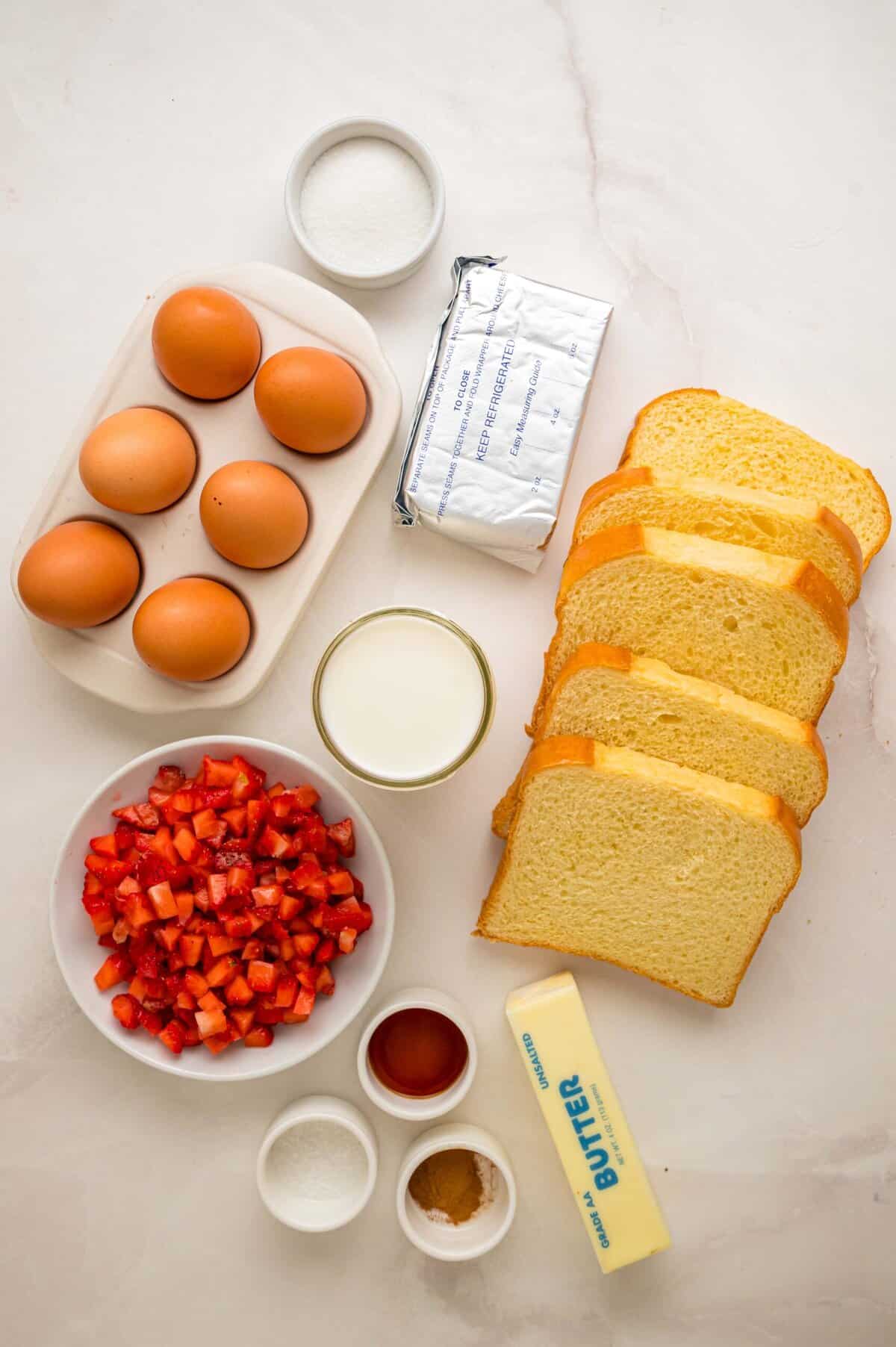 This Cream Cheese Stuffed French Toast recipe is an easy, decadent way to elevate basic French toast. Perfect for weekend brunch! Overhead view of ingredients needed to make stuffed French toast