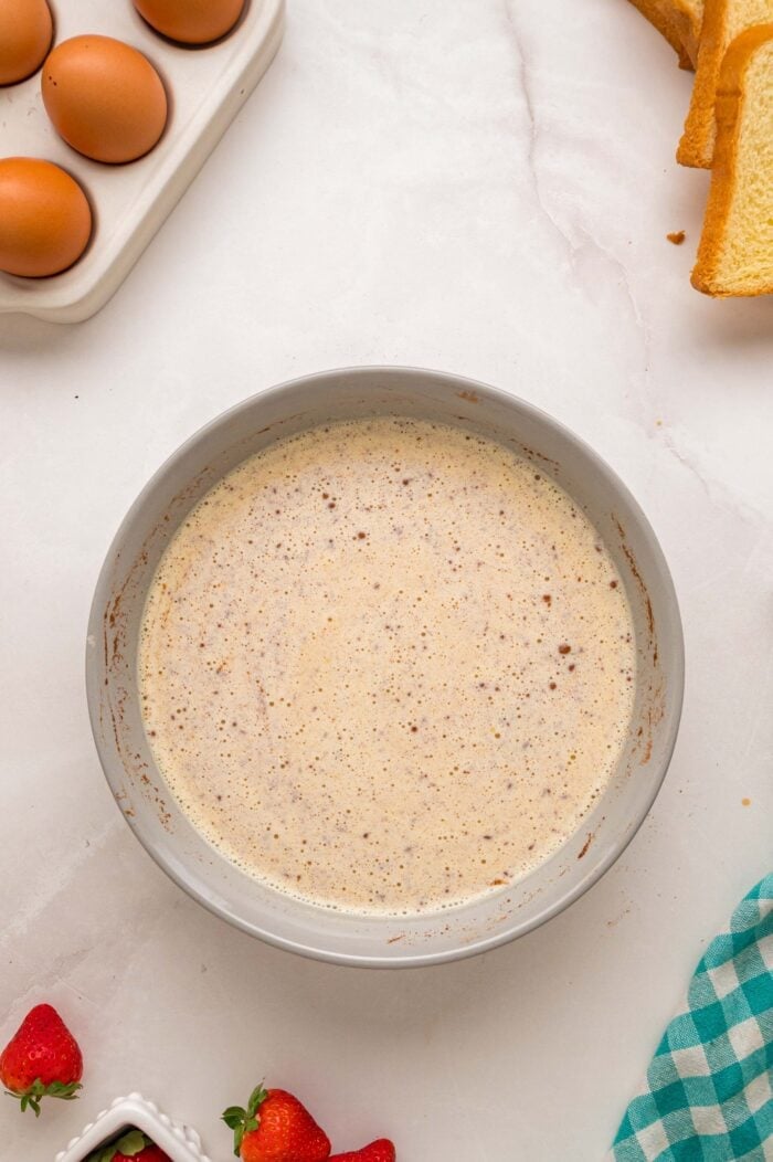 This Cream Cheese Stuffed French Toast recipe is an easy, decadent way to elevate basic French toast. Perfect for weekend brunch! French toast egg batter in a bowl