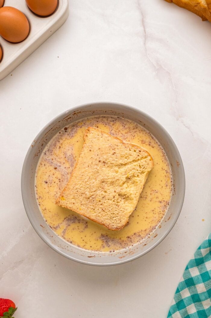 This Cream Cheese Stuffed French Toast recipe is an easy, decadent way to elevate basic French toast. Perfect for weekend brunch! Stuffed French toast dipped in egg batter