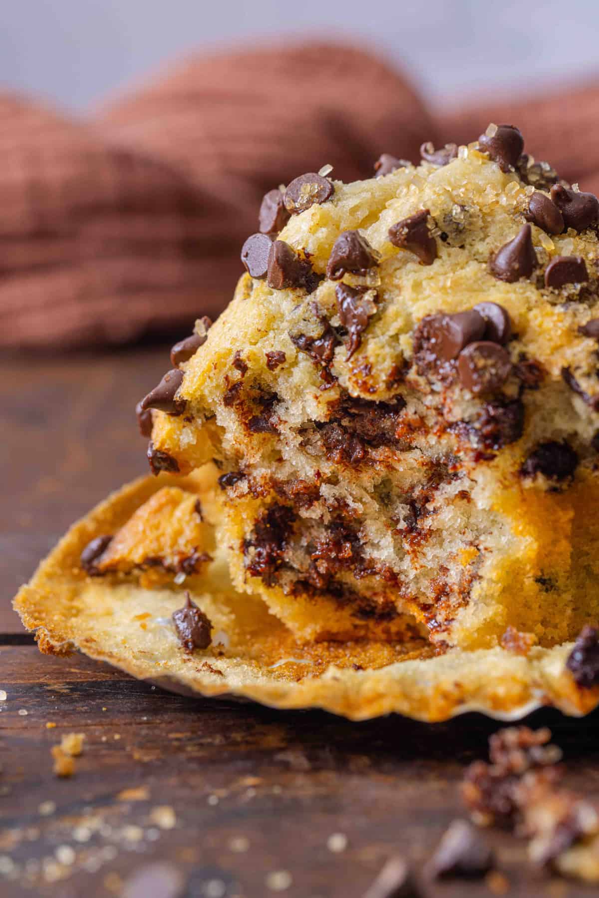 A chocolate chip muffin with a bite missing