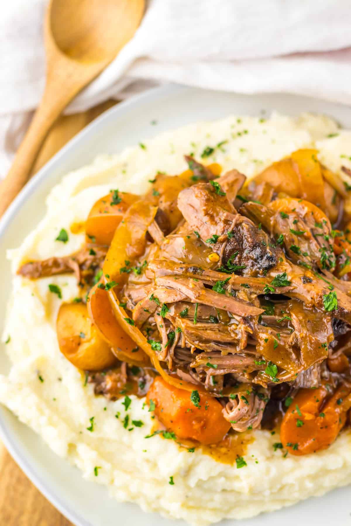 This Slow Cooker Coca Cola Pot Roast is the ultimate hearty, comforting dinner that practically makes itself. Coca cola pot roast over mashed potatoes
