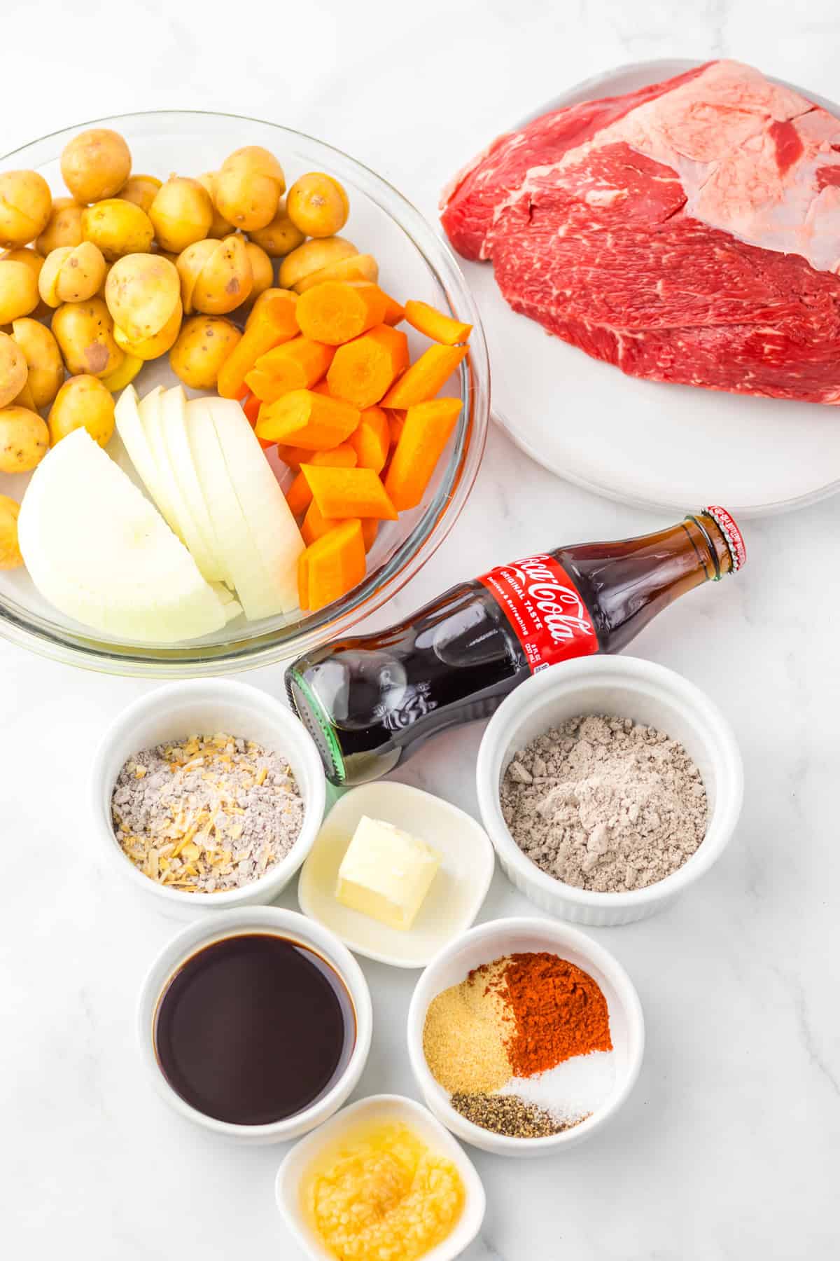 This Slow Cooker Coca Cola Pot Roast is the ultimate hearty, comforting dinner that practically makes itself. Overhead view of ingredients needed for Coca Cola pot roast