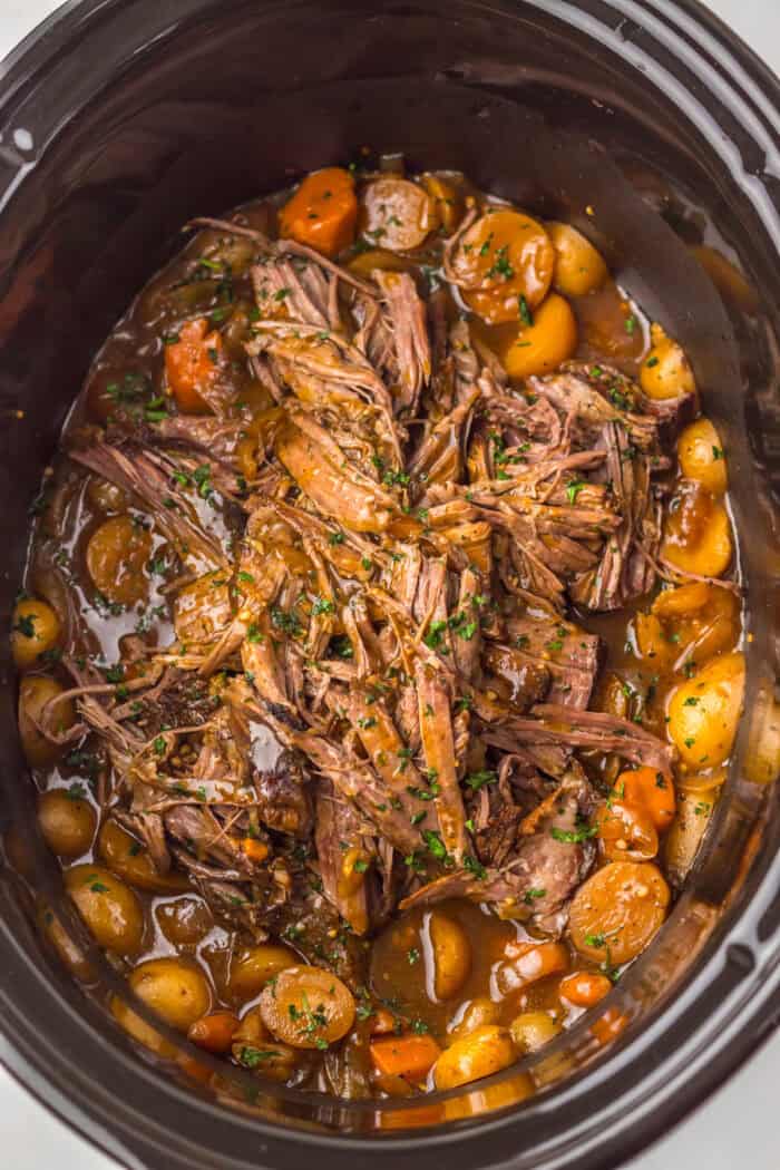 This Slow Cooker Coca Cola Pot Roast is the ultimate hearty, comforting dinner that practically makes itself. Overhead view of crock pot coca cola pot roast
