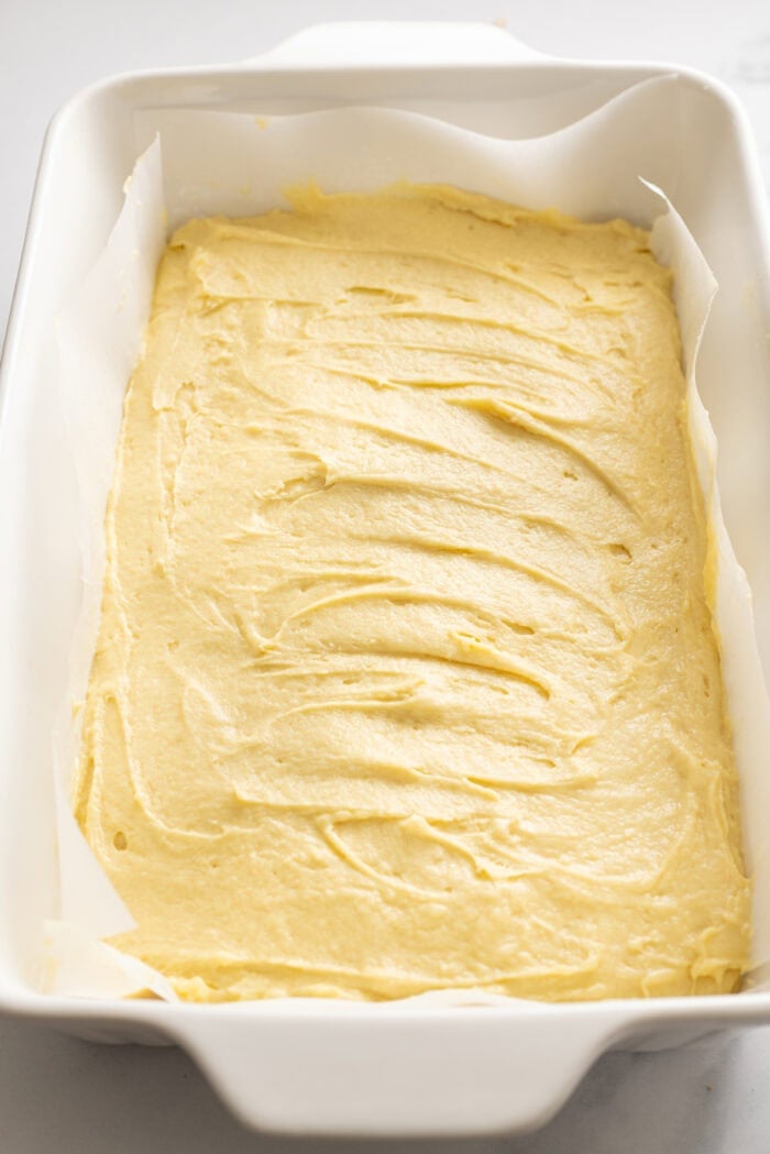 Crumb cake batter spread in a baking dish