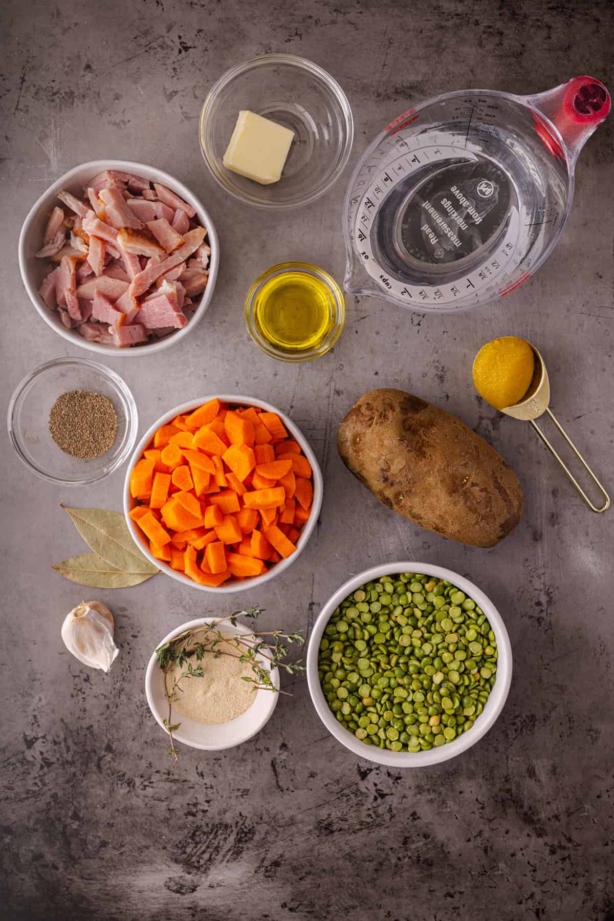 With just a handful of ingredients and minutes of prep, this Slow Cooker Split Pea Soup with Ham might be the easiest soup recipe ever. Overhead view of ingredients needed to make slow cooker split pea soup