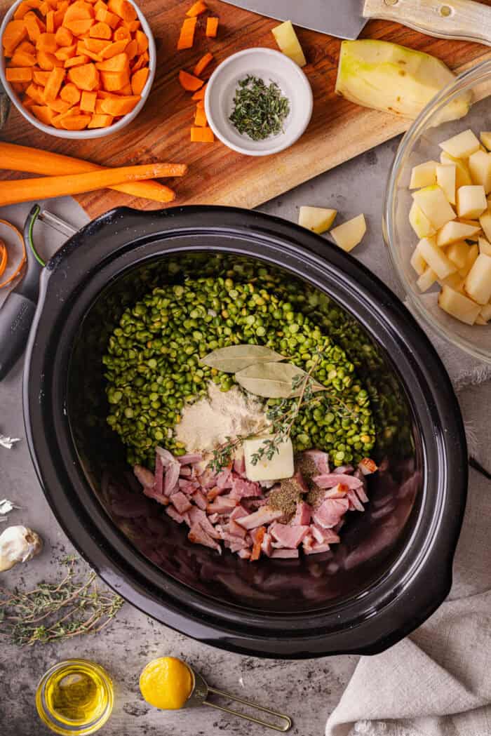 With just a handful of ingredients and minutes of prep, this Slow Cooker Split Pea Soup with Ham might be the easiest soup recipe ever. Ham, split peas, and seasonings in a slow cooker
