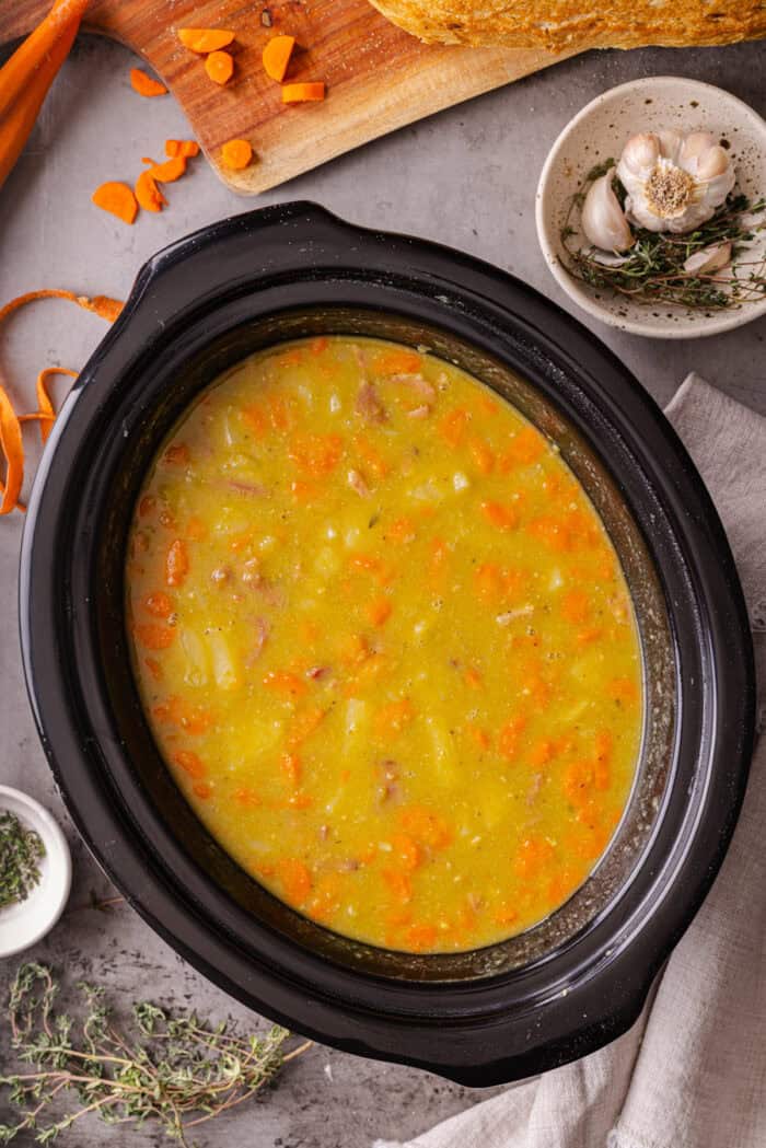With just a handful of ingredients and minutes of prep, this Slow Cooker Split Pea Soup with Ham might be the easiest soup recipe ever. Split pea soup in the slow cooker