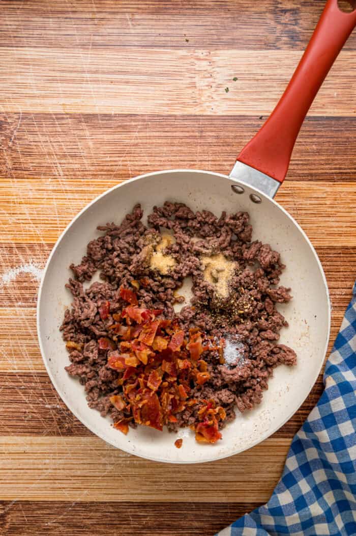 Ground beef and bacon in a skillet