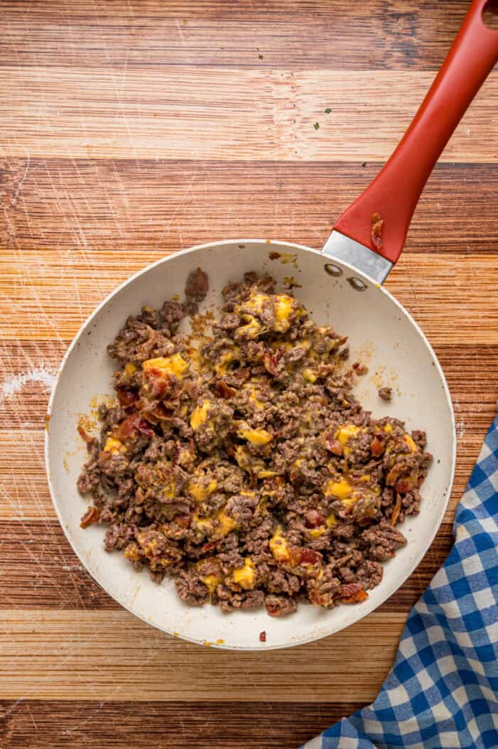 Ground beef with melted Velveeta in a skillet