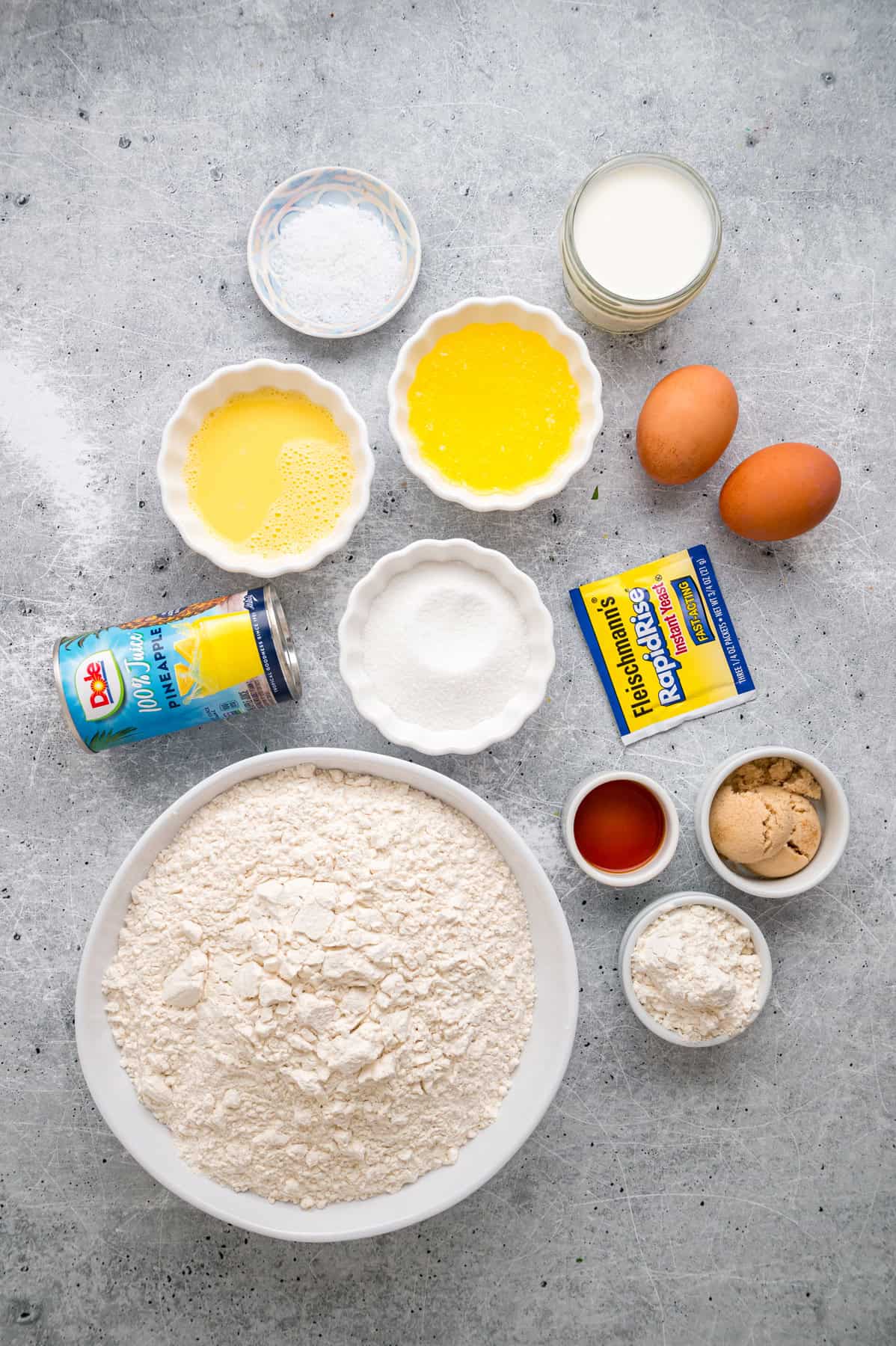 This Hawaiian Rolls recipe makes soft, fluffy rolls that taste just like the store-bought version – maybe even better. Overhead view of ingredients needed to make Hawaiian rolls recipe